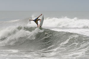 Thomas Lange launching of a wave in Hermosa.